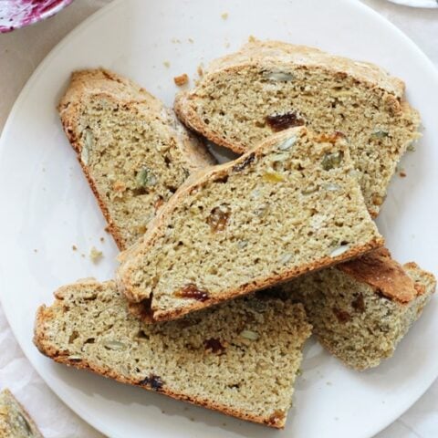 Easy to make whole wheat irish soda bread! Crusty on the outside, dense yet tender on the inside and hard to resist! Especially when slathered with jam! And it’s dairy free!