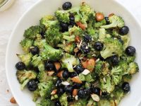 This simple roasted broccoli salad is healthy, fresh and a fun twist on the classic dish! Filled with blueberries, almonds and a maple mustard dressing! Vegan, gluten free, and no mayo in sight!