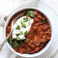 Crowd pleasing sweet potato turkey chili with black beans! Easy, healthy and simple, this delicious stovetop chili is packed with smoky, spicy flavor! And a touch of sweetness from the potatoes and cinnamon! Excellent for dinner or parties!