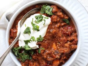 Crowd pleasing sweet potato turkey chili with black beans! Easy, healthy and simple, this delicious stovetop chili is packed with smoky, spicy flavor! And a touch of sweetness from the potatoes and cinnamon! Excellent for dinner or parties!