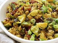 Healthy cranberry quinoa salad with brussels sprouts! Filled with crunchy almonds, dried cranberries and warm spices, it’s perfect for make-ahead meals or sides! Vegan & gluten free!