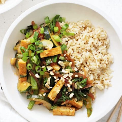 Easy and delicious kung pao tofu! A healthier and lighter take on the popular take-out dish! With a sweet yet savory sauce, tons of veggies and it cooks in one skillet! Vegan & gluten free!