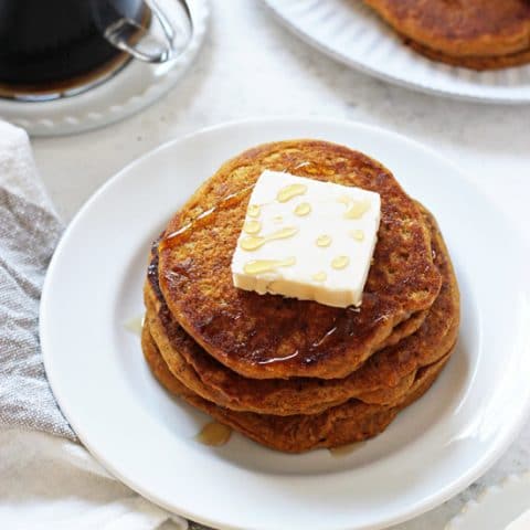 Tender, fluffy, melt-in-your mouth vegan sweet potato pancakes! These easy and healthy pancakes are filled with sweet potato puree, almond milk, cinnamon and olive oil! And they reheat beautifully, making them perfect for busy mornings!
