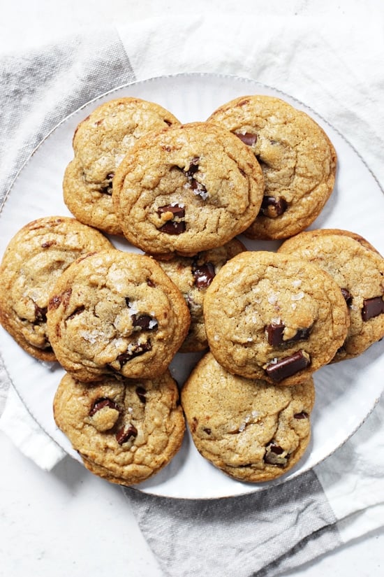 A large plate of Mint Chocolate Chip Cookies with a white and grey napkin in the background.