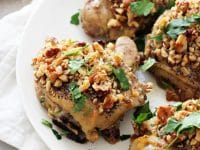Tender, juicy baked honey mustard chicken thighs! With just a few minutes of prep, these are perfect for an easy, healthy weeknight meal! Topped with crunchy walnuts and a honey mustard sauce for drizzling!
