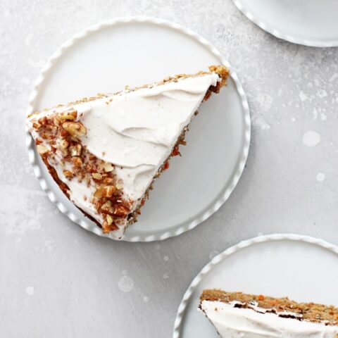 This dreamy dairy free carrot cake is soft, moist and packed with fresh carrots and pecans! Topped with a dairy free cream cheese icing that is absolutely delicious! Perfect for spring baking or anytime of the year!