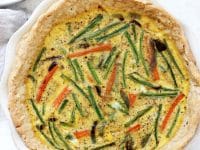 Veggie packed dairy free quiche! Made with a coconut oil pie crust, eggs, almond milk and lots of colorful veggies! It’s a lighter take on the classic brunch dish! Perfect for potlucks, mother’s day and easter!