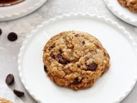 Perfectly soft and chewy coconut oil oatmeal cookies! Super easy to make and no mixer required! Packed with rolled oats and dark chocolate chips, these dairy free cookies are excellent for any day of the week!