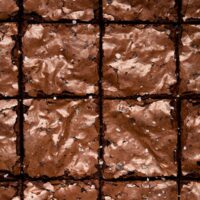 Sliced close together squares of Dairy Free Fudgy Brownies.