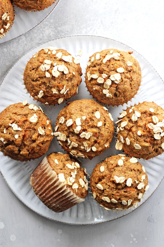 A white plate filled with Healthy Carrot Muffins.