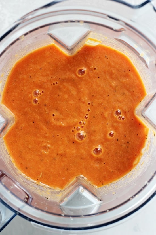 A blender filled with pureed Non Dairy Tomato Soup.