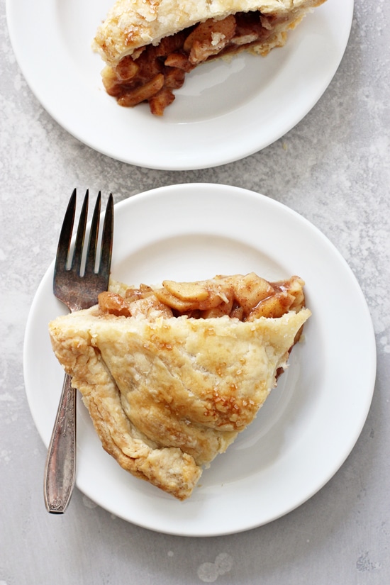 Two slices of Dairy Free Apple Pie on white plates.