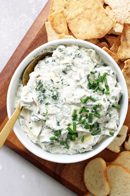 Dairy Free Spinach Dip in a serving platter with chips.