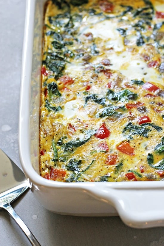 A cooked Dairy Free Vegetable Frittata in a white baking dish.