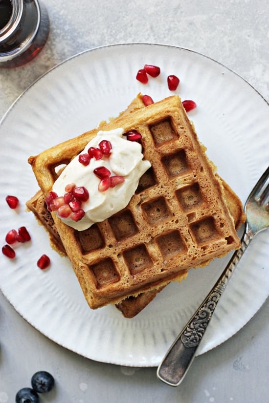 Two Classic Dairy Free Waffles on a white plate with a fork.