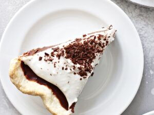 Three slices of Dairy Free Chocolate Pie on white plates.