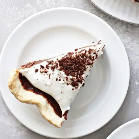 Three slices of Dairy Free Chocolate Pie on white plates.