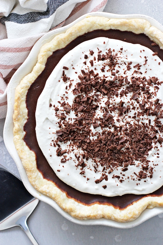 A Dairy Free Chocolate Cream Pie with a cake knife to the side.