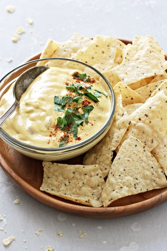 Dairy Free Queso on a platter with tortilla chips.