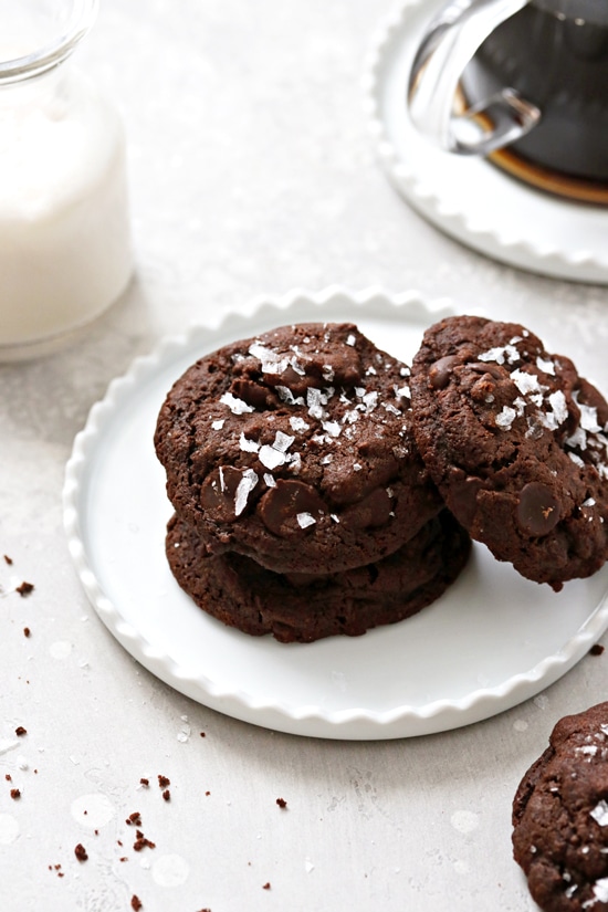 Three Dairy Free Double Chocolate Chip Cookies on a white plate.