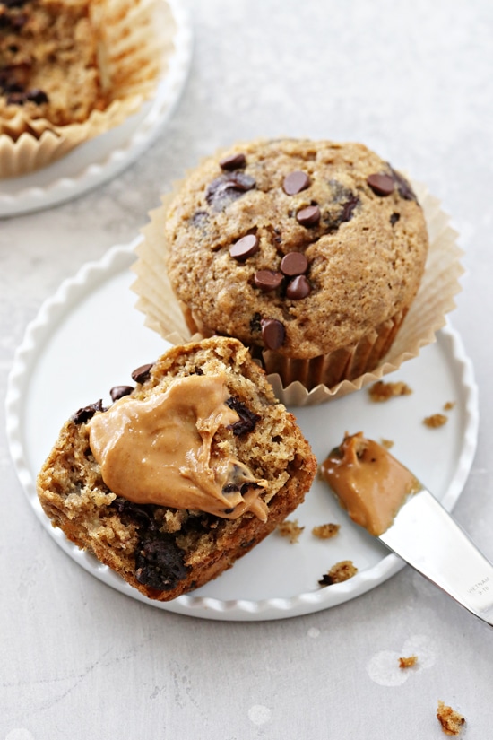 A Dairy Free Chocolate Chip Muffin split open and smeared with peanut butter.