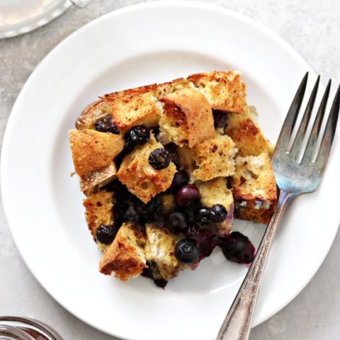 A serving of Dairy Free French Toast Casserole on a plate with a fork.