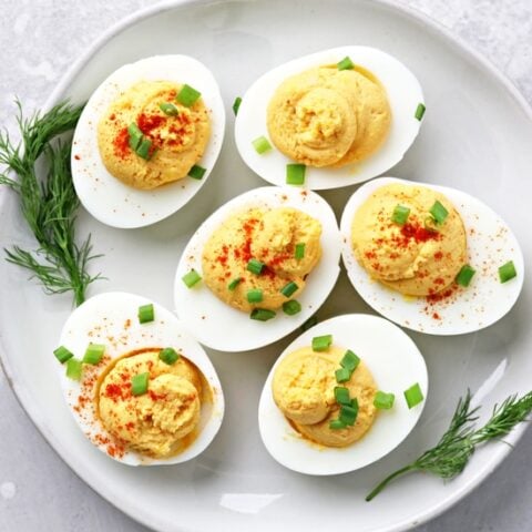 A plate filled with Dairy Free Deviled Eggs.