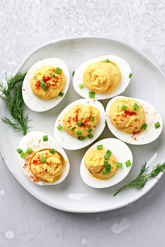 A plate filled with Dairy Free Deviled Eggs.