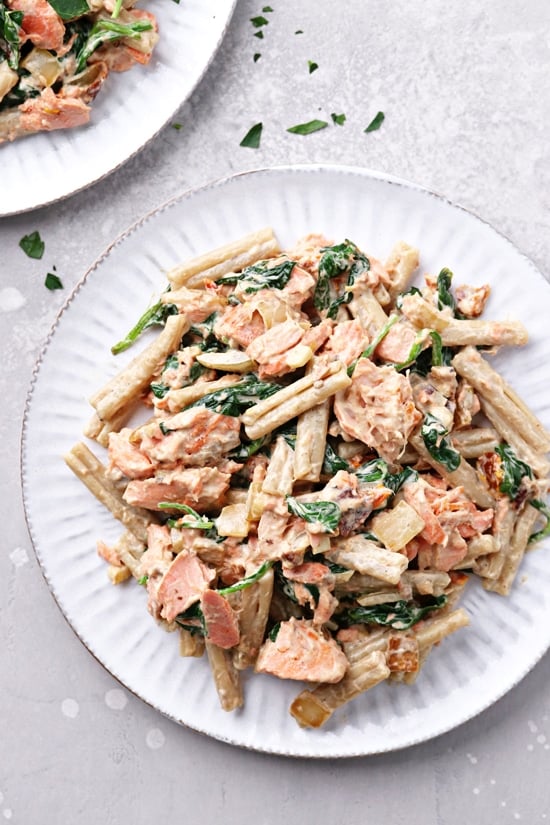 Two plates filled with Dairy Free Salmon Pasta.