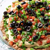 A pie dish filled with Dairy Free Taco Dip.