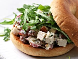 Dairy Free Chicken Salad piled on a bagel.