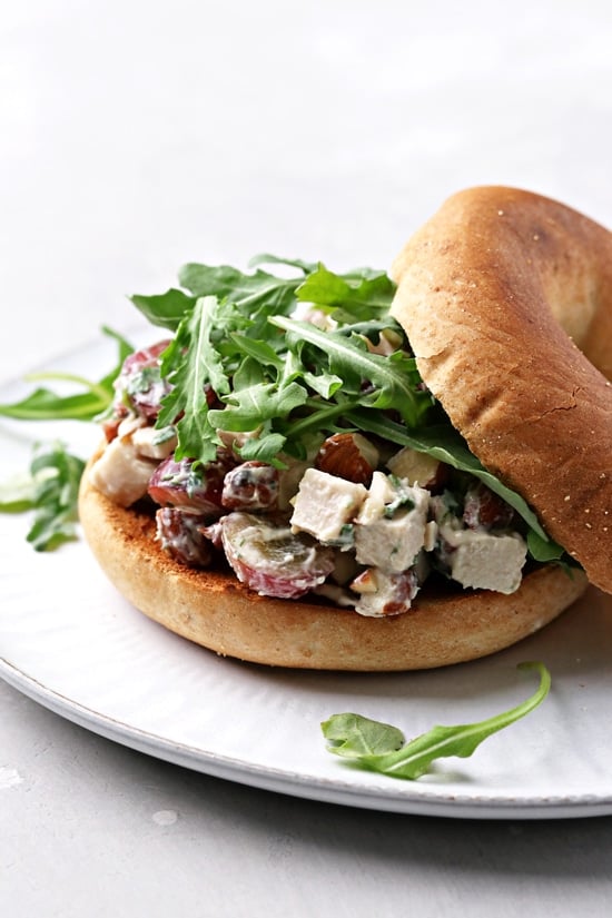 Dairy Free Chicken Salad piled on a bagel.