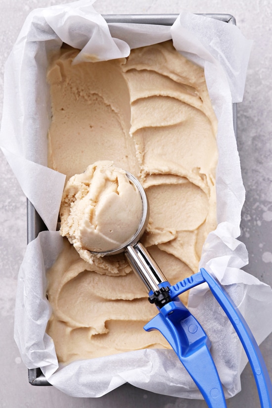 Non Dairy Peanut Butter Ice Cream in a container with a scoop removed.