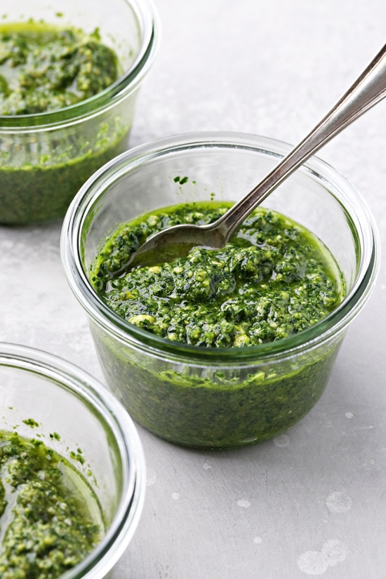 Three jars filled with Pesto Without Cheese.