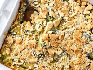 A white baking dish filled with Dairy Free Broccoli Casserole.