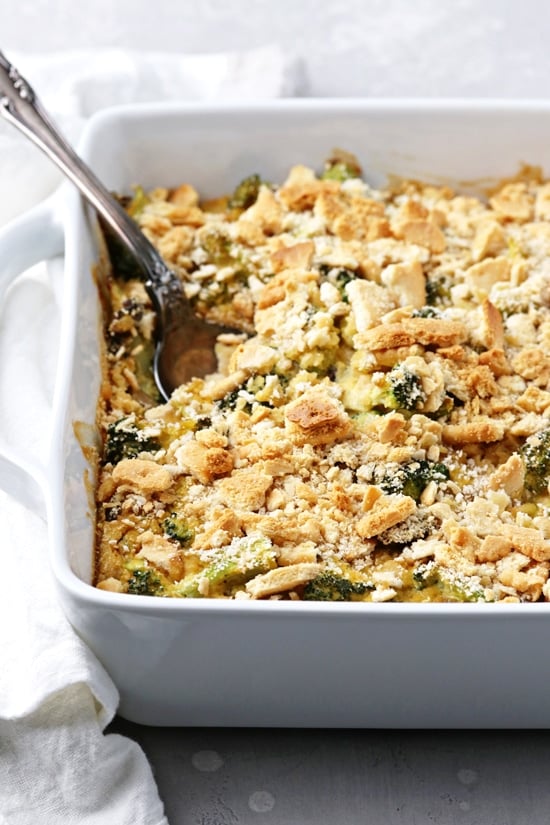 Non Dairy Broccoli Casserole in a baking dish with a spoon.