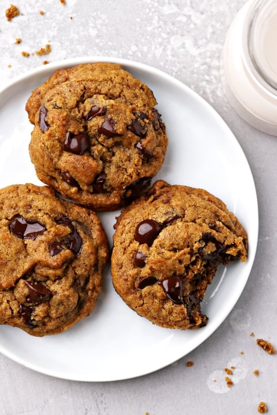 Three Dairy Free Pumpkin Chocolate Chip Cookies on a plate.