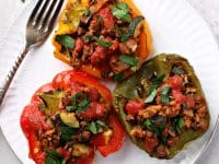 Three Dairy Free Stuffed Peppers on a plate.