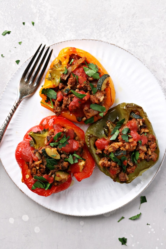 Three Dairy Free Stuffed Peppers on a plate.