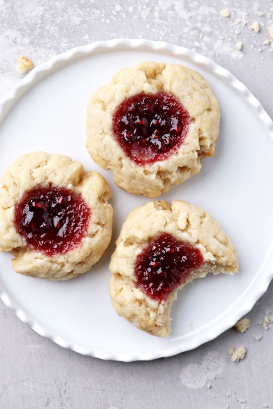 Egg Free Thumbprint Cookies on a plate with a bite taken out of one.