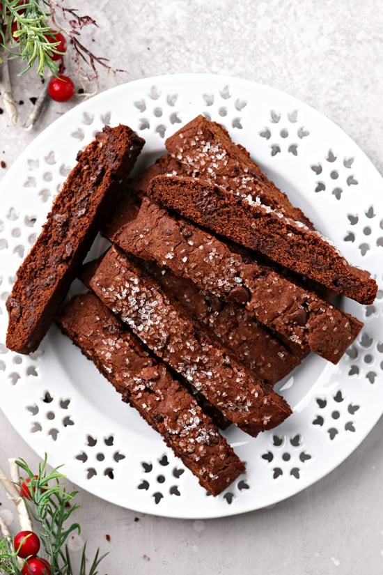 A white plate filled with Vegan Double Chocolate Biscotti.