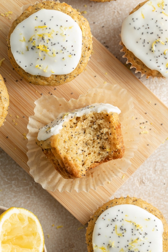 A Dairy Free Lemon Poppyseed Muffin with a bite taken out.