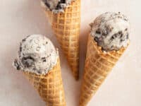 Three cones filled with Dairy Free Cookies and Cream Ice Cream.