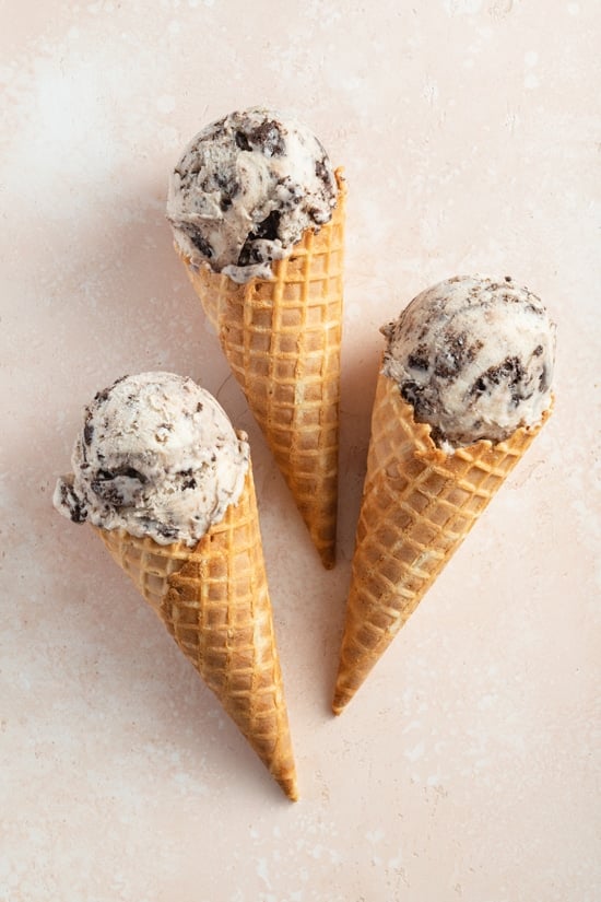 Three cones filled with Dairy Free Cookies and Cream Ice Cream.