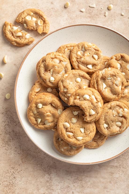 A plate filled with Dairy Free White Chocolate Macadamia Nut Cookies.