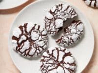 Dairy Free Chocolate Crinkle Cookies on plates with festive decorations.
