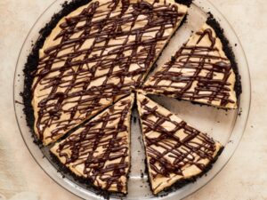 A Dairy Free Peanut Butter Pie partially sliced.