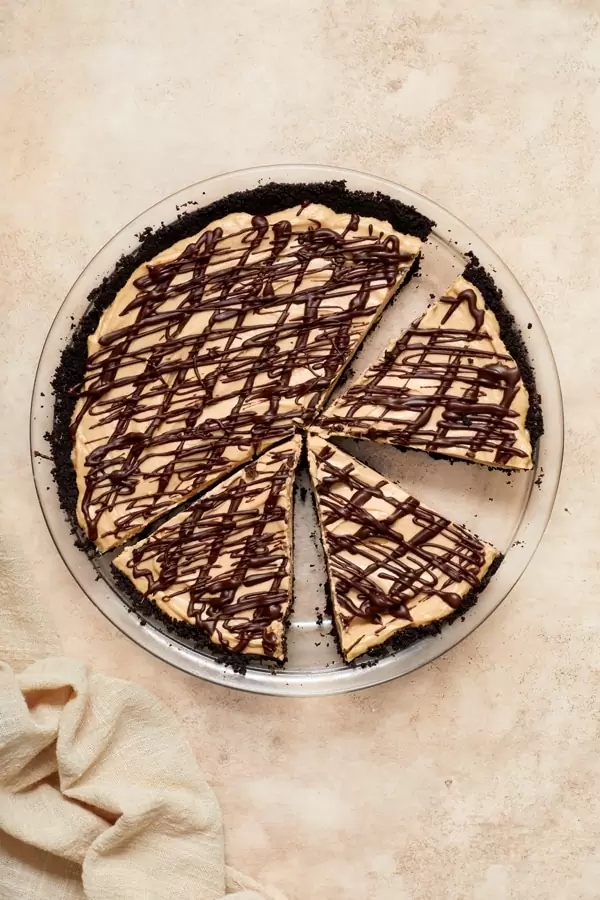 A Dairy Free Peanut Butter Pie partially sliced.
