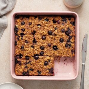 A baking dish of Dairy Free Baked Oatmeal cut into squares.