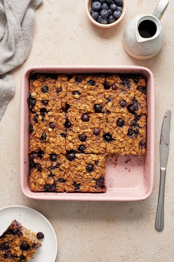 A baking dish of Dairy Free Baked Oatmeal cut into squares.